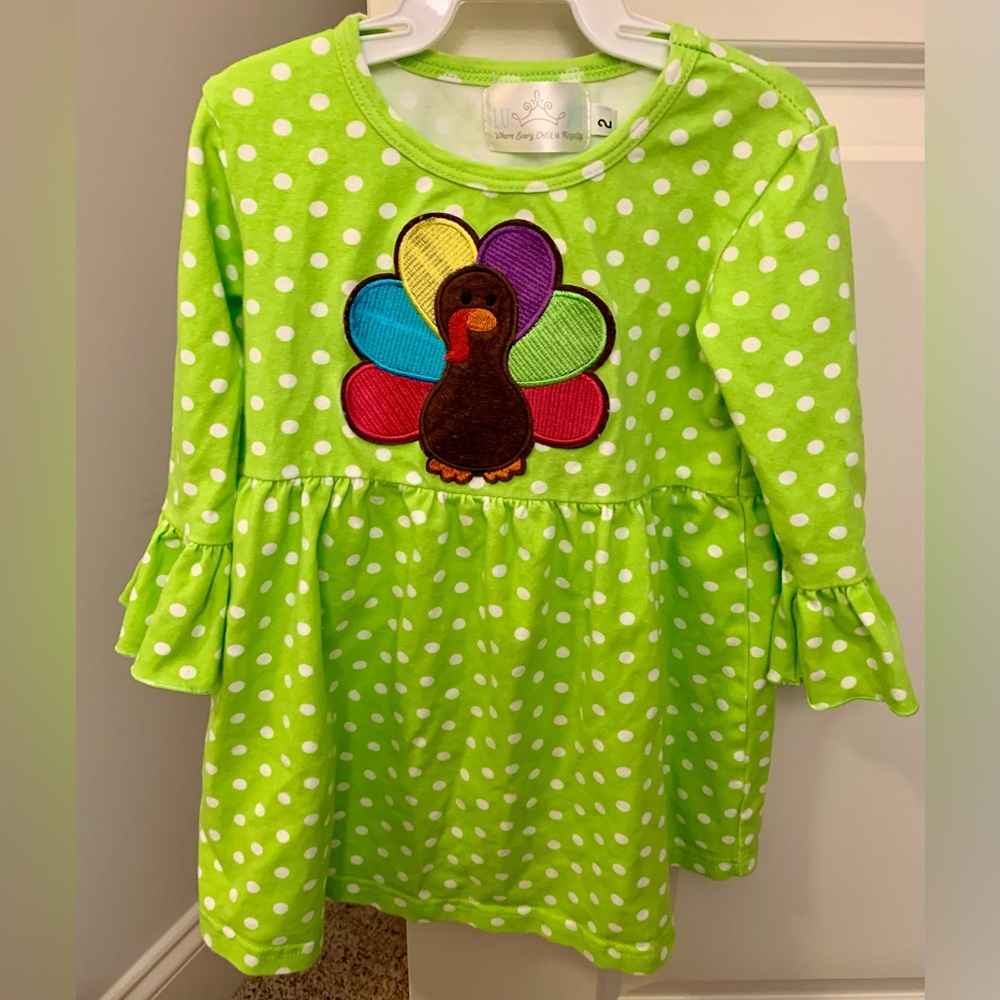 Green polka dot dress with colorful turkey appliqué